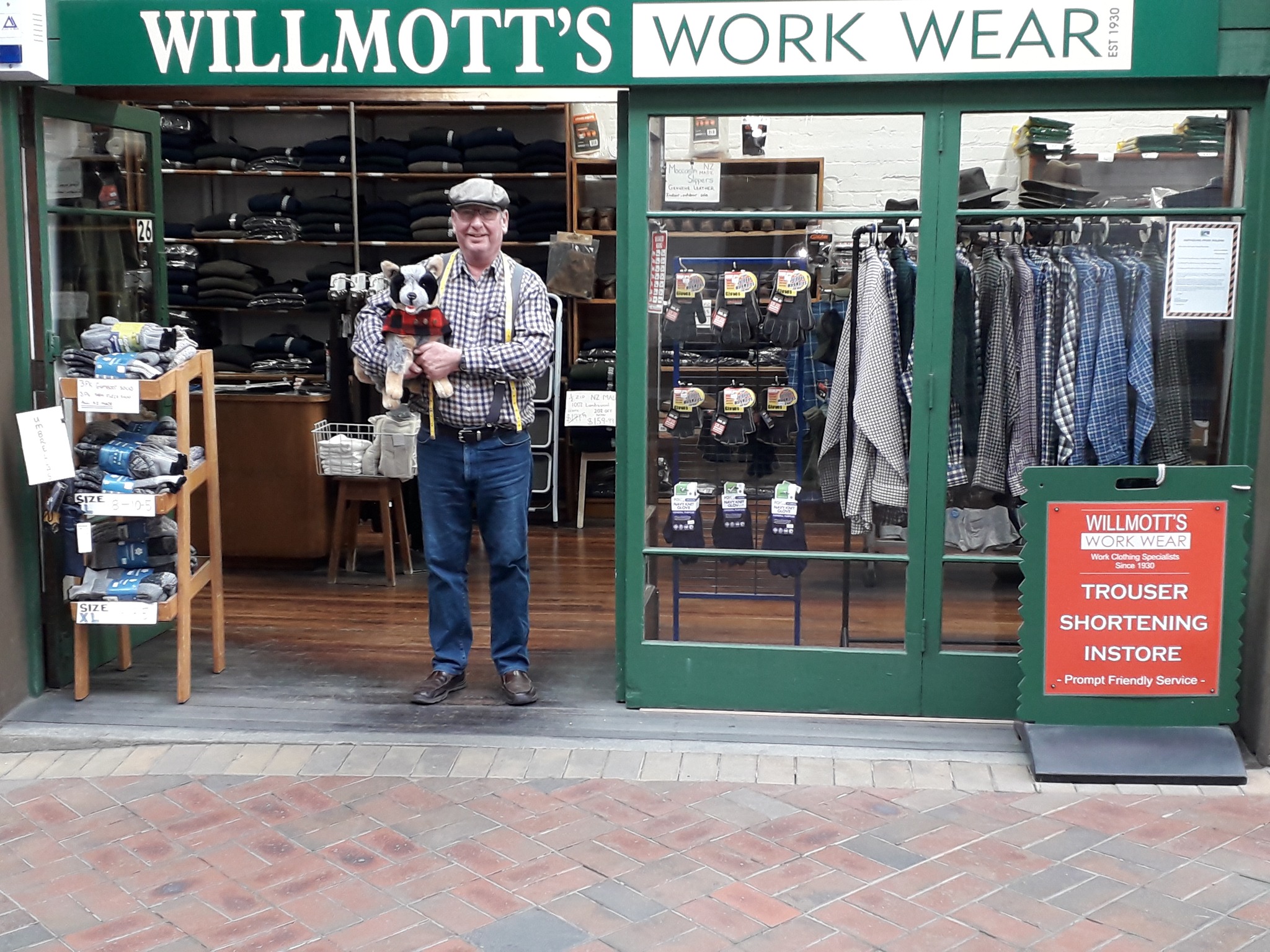 Willmotts Shop Front with the owner standing in the doorway